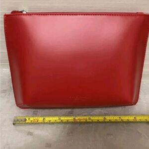 GIVENCHY PARFUMS-
Red Zip Pouch